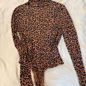 Women’s mesh cheetah print bodysuit. Excellent condition never worn!
